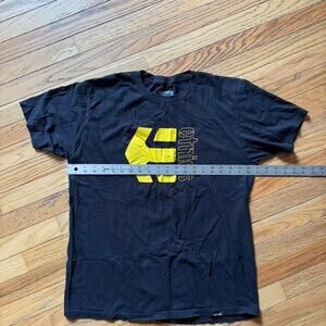 Etnies black t shirt with yellow logo